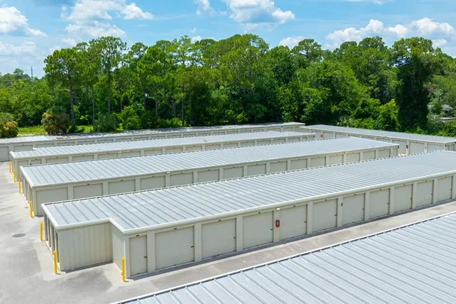 Drive-up storage units with multiple buildings and easy vehicle access
